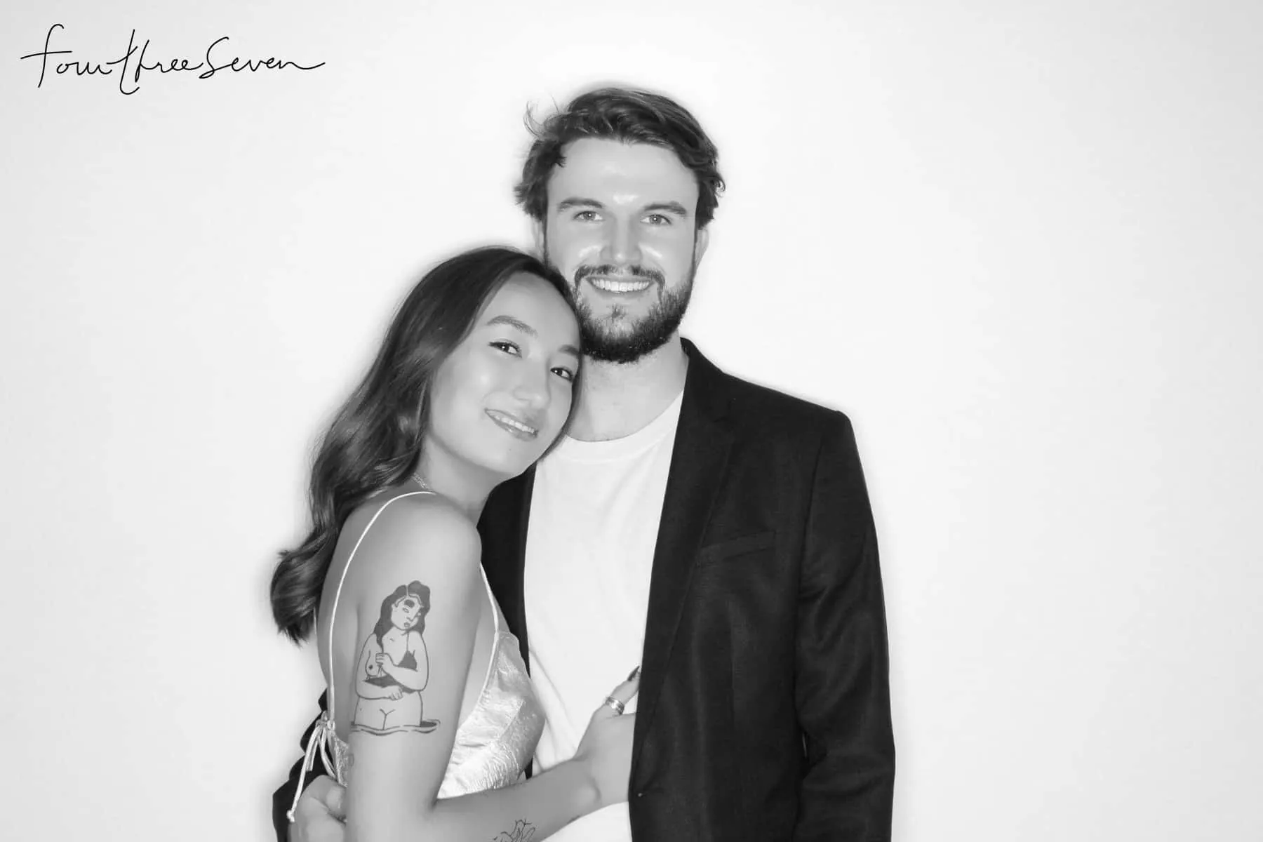 Black and white photo booth portrait of couple